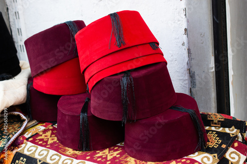Turkish traditional red hat fez, fes or tarboosh with arabic  or Ottoman style photo