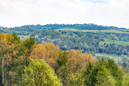 Polish suburb near Krakow. Spring in Central Europe. Hilly village near a major city.