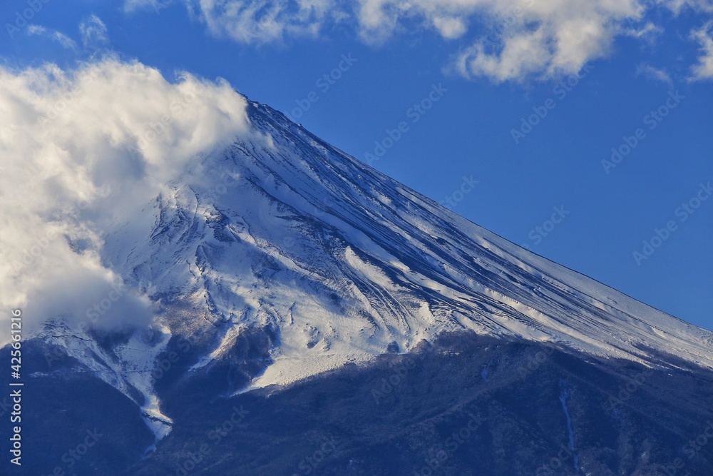 Snow covered mountains, The summit of Mount Fuji is covered with snow and clouds.