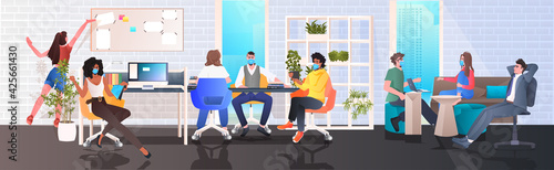 mix race businesspeople in masks working in modern office teamwork coronavirus quarantine concept