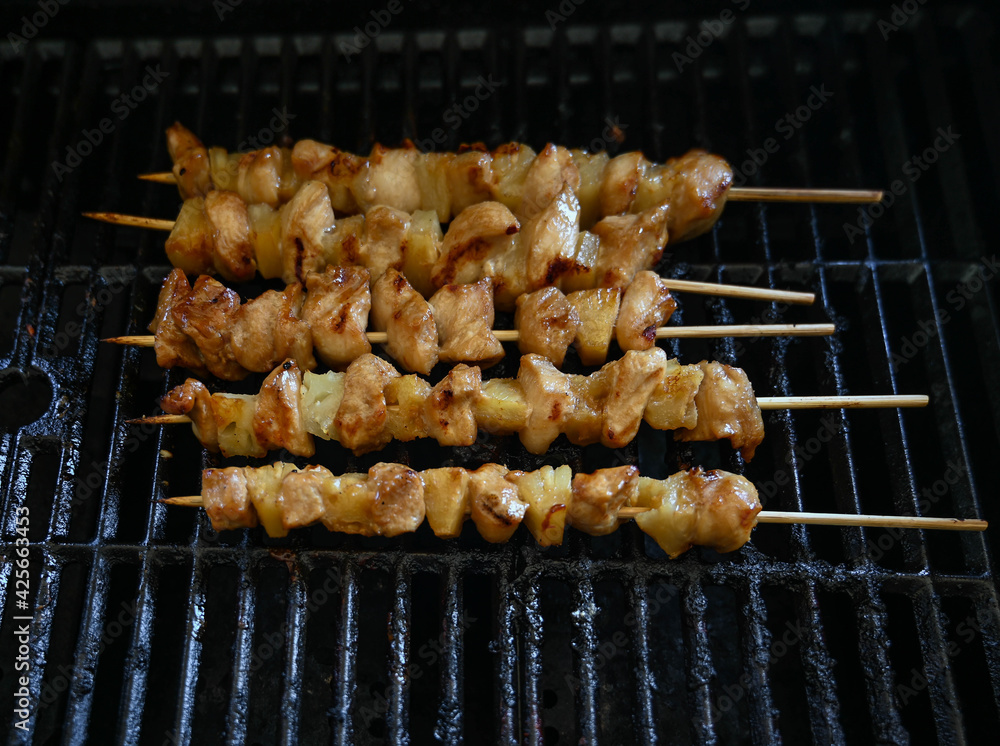 BBQ chicken and pork steaks grilling in Illinois, USA BBQ chicken and pork steaks grilling in Illinois, USA