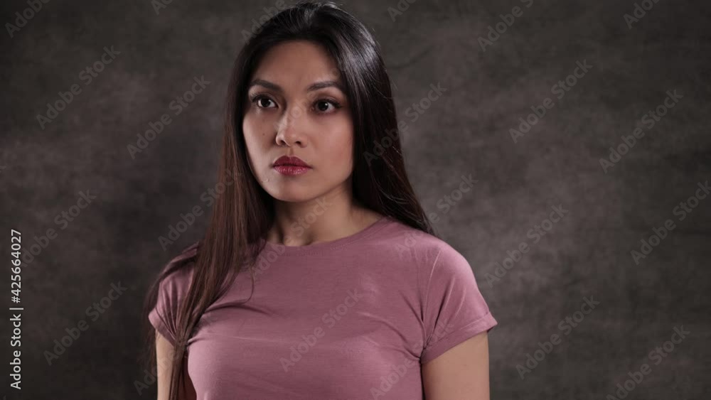 Young pretty woman posing for the camera - studio shooting Young pretty woman posing for the camera - studio shooting