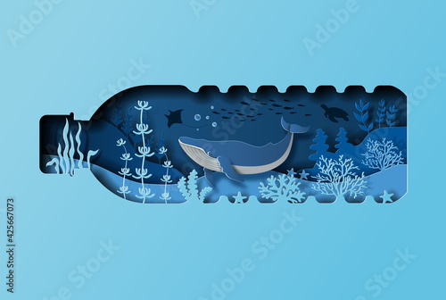 Fotografia World oceans day concept, the blue whale in a bottle of water