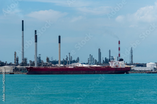 Singapore refinery - oil tanker ship berthed in oil terminal. 