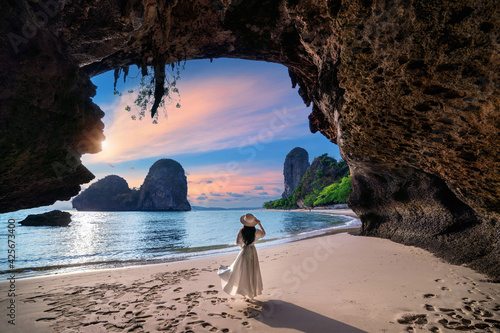 Woman walking on Railay beach, Krabi in Thailand. photo