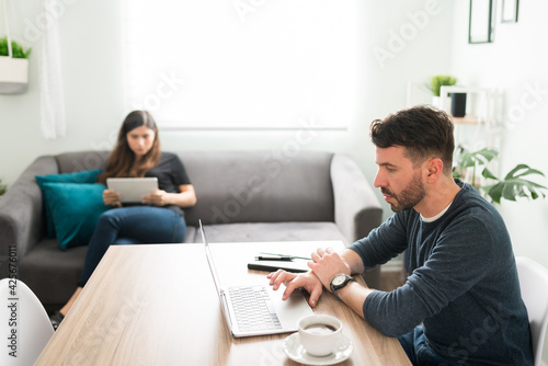 Attractive couple working together at home