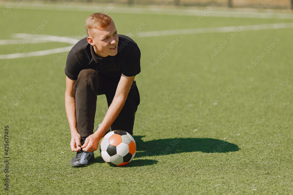 Sporman is playing football and practising with the ball Sporman is playing football and practising with the ball