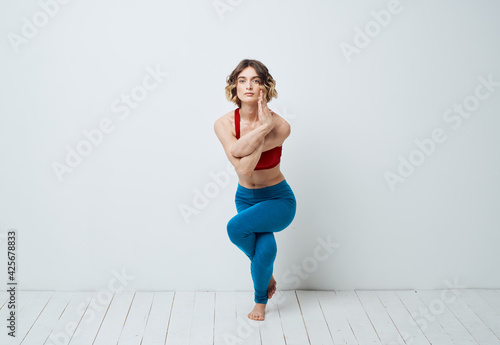 woman in blue leggings gymnastics sport fitness yoga asana