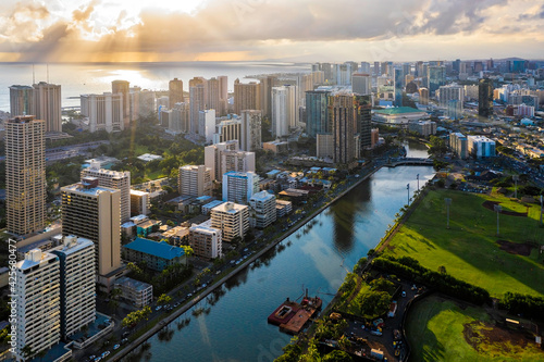 Aerial view of Waikiki district tall buildings at sunset. Tall buildings by Ala Wai Canal. Oahu Island  Hawaii