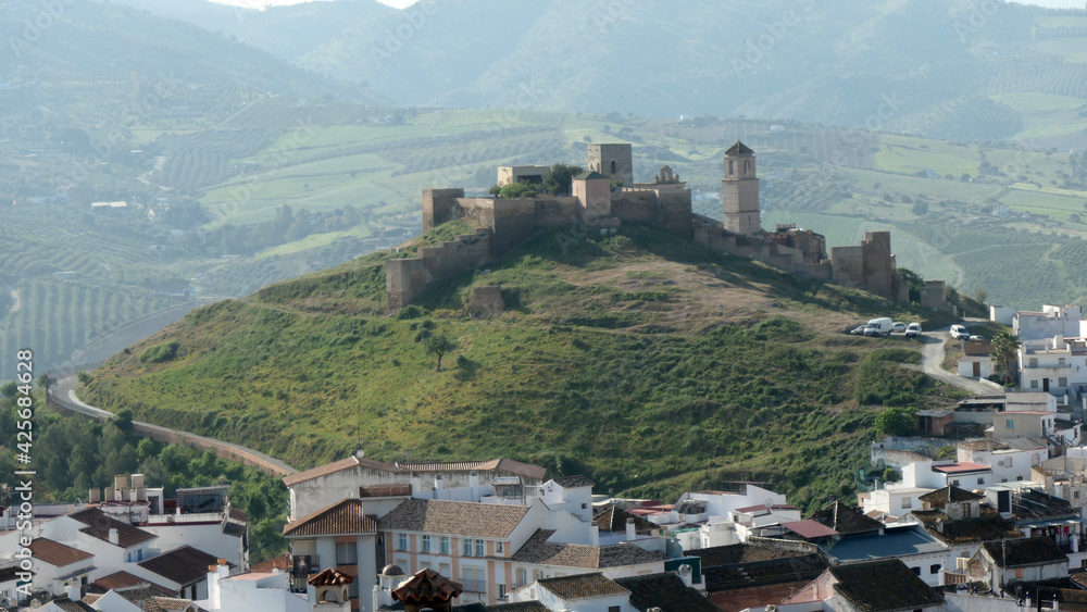 Hilltop castle on hazy day in Southern Andalusia