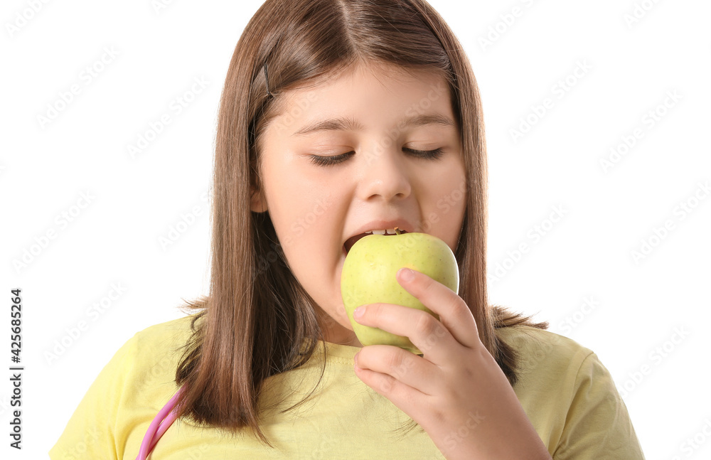 Overweight girl eating healthy apple on white background Overweight girl eating healthy apple on white background