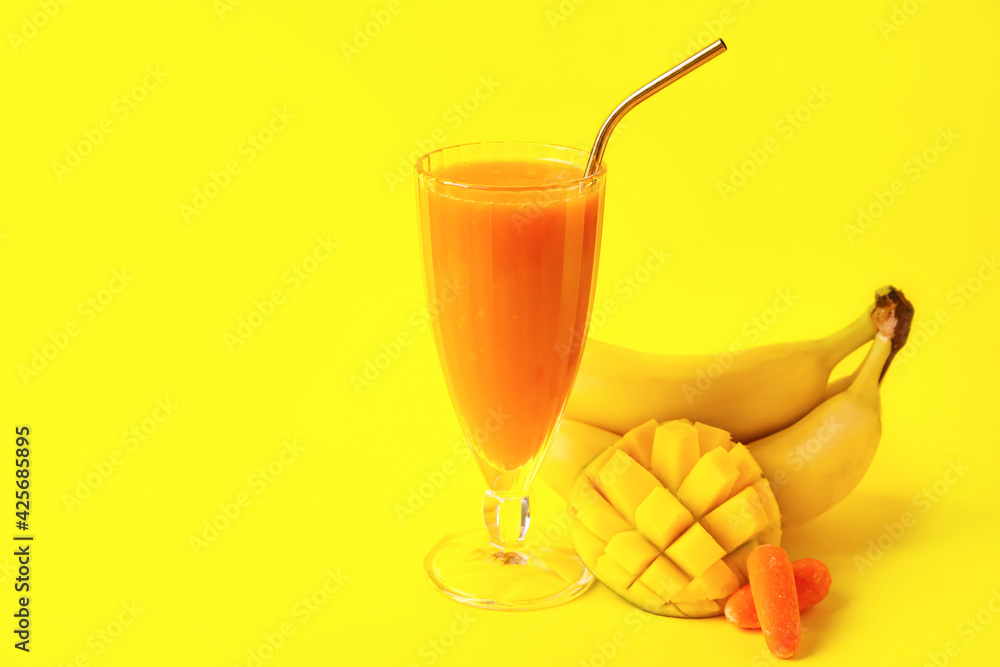 Glass of healthy smoothie and ingredients on color background Glass of healthy smoothie and ingredients on color background