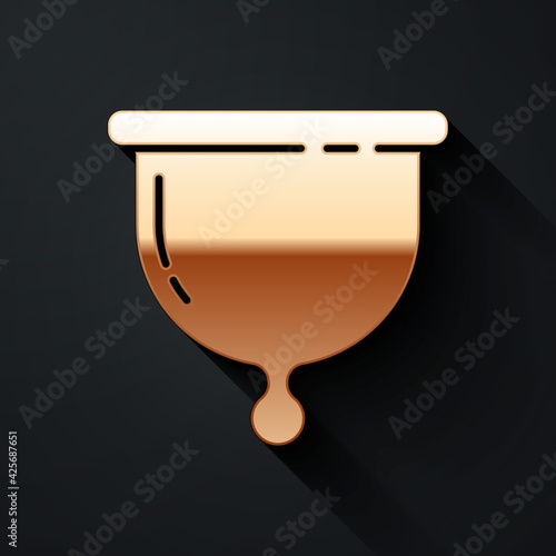 Gold Menstrual cup icon isolated on black background. Feminine hygiene. Protection for woman in critical days. Long shadow style. Vector