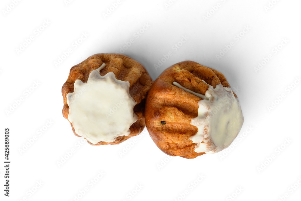 Sweet Rum Baba cake with powdered sugar glaze isolated on white background. Sweet Rum Baba cake with powdered sugar glaze isolated on white background.