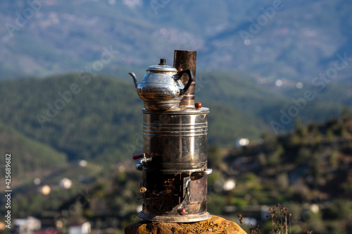 old teapot in mountains photo