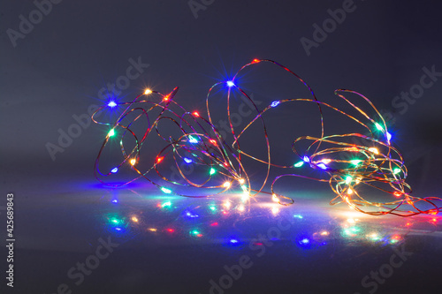 Colorful glowing  fairy light. Holiday festive xmas decoration. Christmas lights. photo