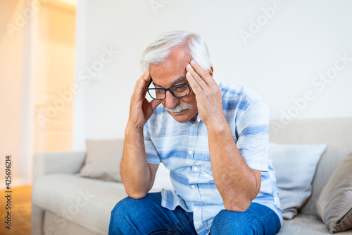 Wallpaper Mural Attack of the monster migraine. Unhappy Retired Senior man holding his head with pain expression . Face of senior man suffering from headache Torontodigital.ca
