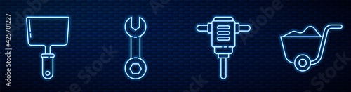 Set line Electric rotary hammer drill, Putty knife, Wrench spanner and Shovel. Glowing neon icon on brick wall. Vector