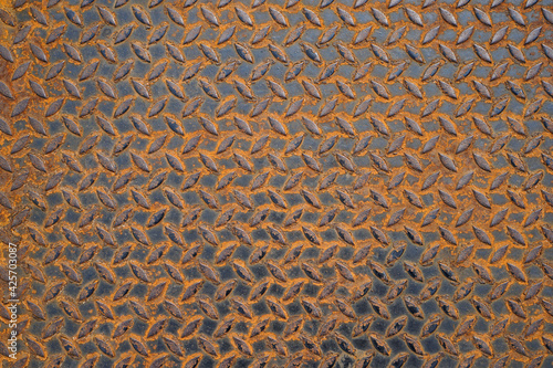 Pattern of old metal diamond plate, Surface of black steel floor non-skid with rusted, Texture background