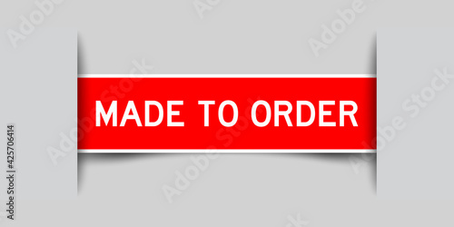 Inserted red color label sticker with word made to order on gray background