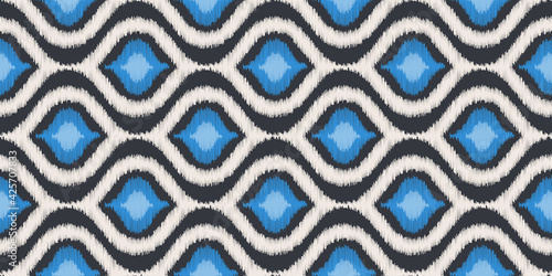 Ikat vector seamless pattern in modern Bohemian style. Ogee textile design