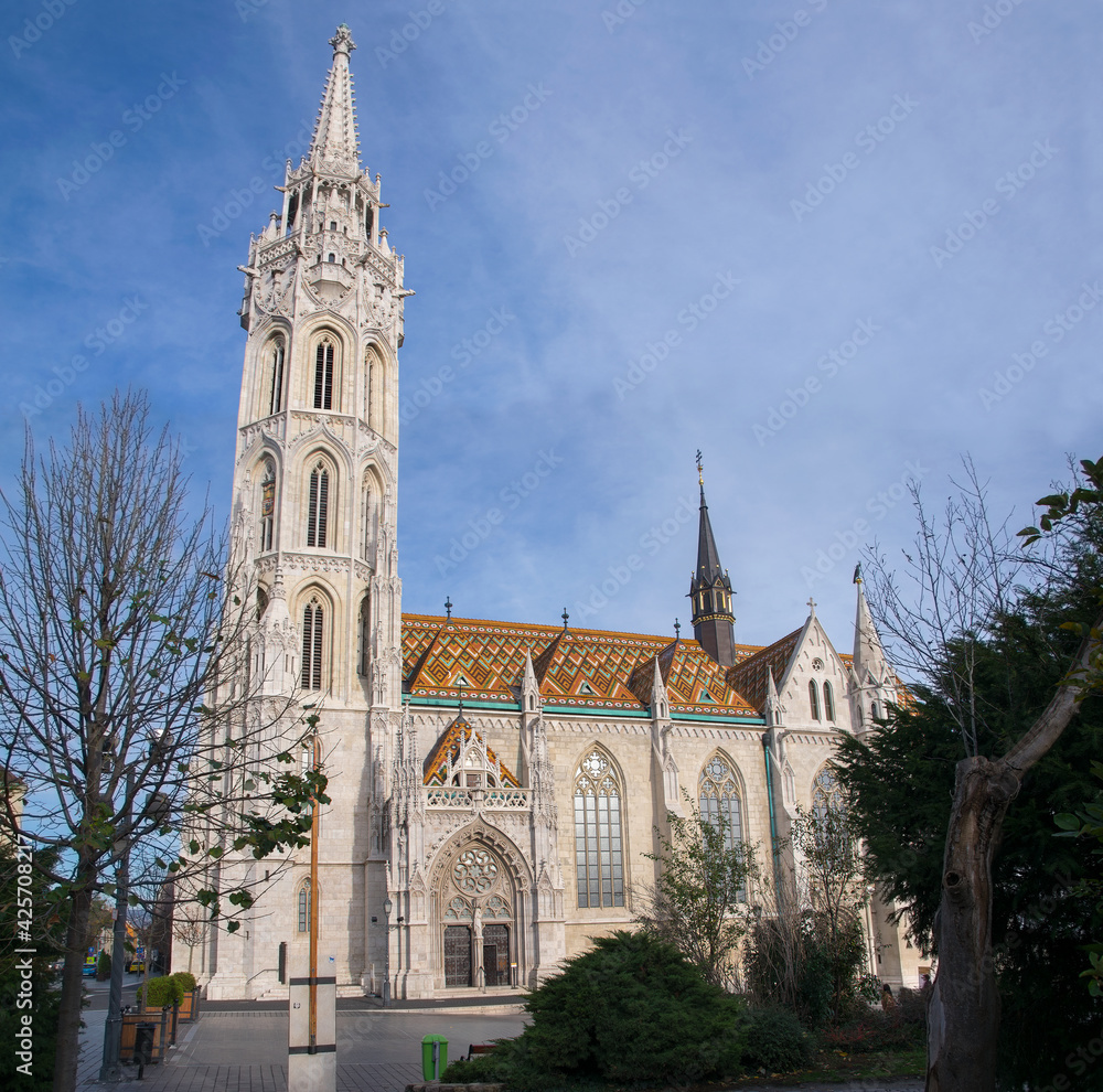 Matthias Church, or the Church of the Assumption of the Buda Castle, is a Roman Catholic church located in front of the Fisherman's Bastion Matthias Church, or the Church of the Assumption of the Buda Castle, is a Roman Catholic church located in front of the Fisherman's Bastion