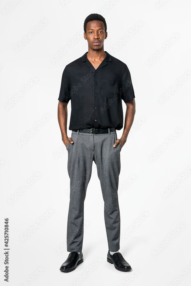 African American man in black shirt and gray slacks business wear full body African American man in black shirt and gray slacks business wear full body