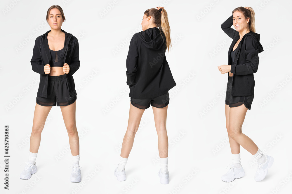 Woman posing in black sportswear full body set Woman posing in black sportswear full body set