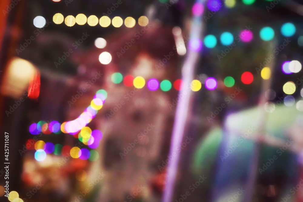 The luminous rays from the lanterns are multicolored, from the bokeh effect of the photo lens