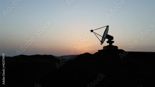 Space radar antenna on sunset. Silhouettes of satellite dishes or radio antennas against night sky. Creative artwork decoration. Selective focus
