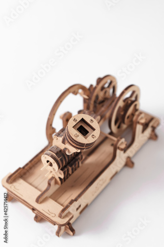 A wooden engine on a white background close-up