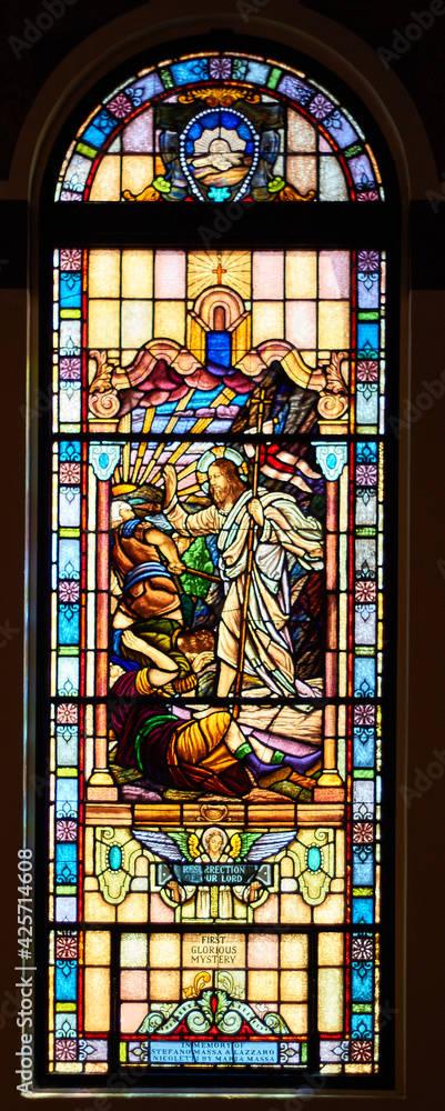 beautiful colored stained glass window in catholic church