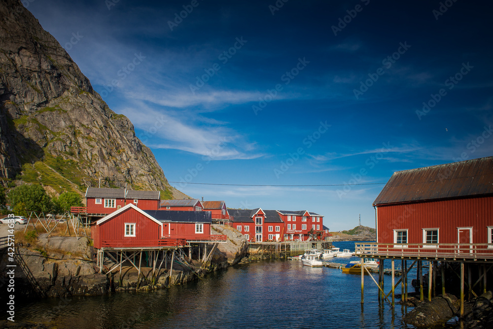 Obraz premium Traditional Norwegian houses near the lake. Fishing village. Wooden houses. Lofoten Islands, Norway