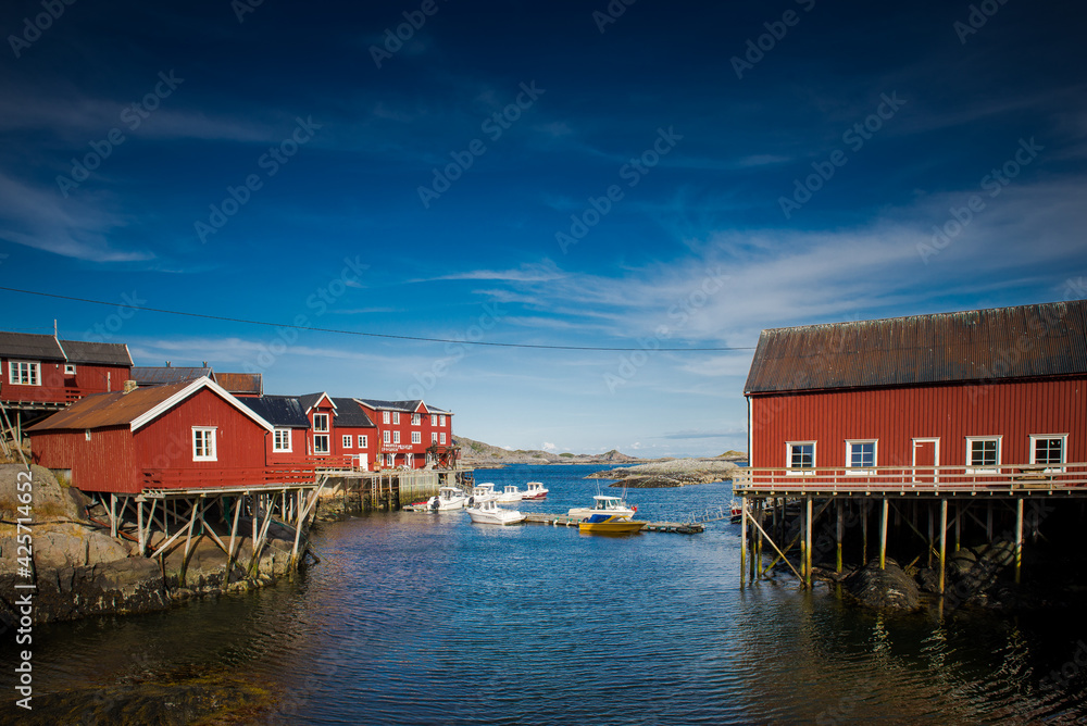 Traditional Norwegian houses near the lake. Fishing village. Wooden houses. Lofoten Islands, Norway