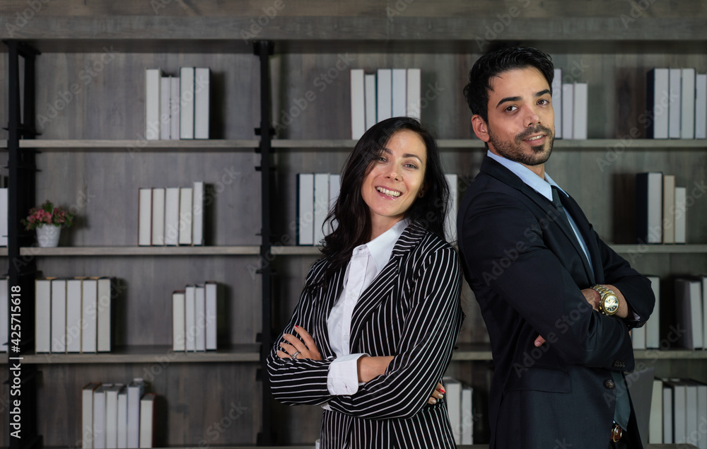young caucasian businesswoman talking with middle east businessman in office. business concept young caucasian businesswoman talking with middle east businessman in office. business concept