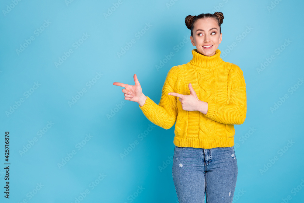 Portrait of attractive cheerful girl demonstrating copy space ad look idea decision isolated over bright blue color background Portrait of attractive cheerful girl demonstrating copy space ad look idea decision isolated over bright blue color background