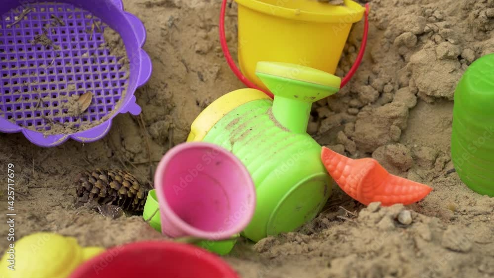 Kids sandbox toys in use. Modern cinematic tracking dolly shot. Kids sandbox toys in use. Modern cinematic tracking dolly shot.