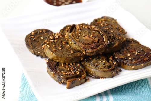 Alu Vadi, Patra, paatra, colocasia leaves roll, Patrode is a popular Indian healthy steamed snack. Garnished with sesame and mustard seeds. served with tamarind chutney. copy space. photo