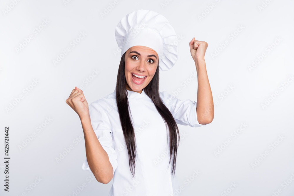 Portrait of impressed cheerful girl fists up open mouth scream yeah celebrate isolated on white color background Portrait of impressed cheerful girl fists up open mouth scream yeah celebrate isolated on white color background