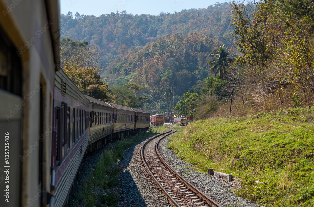 View from the rear of a special express train that leaves from the small station. View from the rear of a special express train that leaves from the small station.
