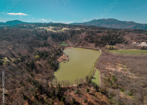 View of lakes in Draga valley, close to Skofljica, Slovenia, on a spring day. Beautiful views of the ponds and marshes at the outskirts of Ljubljansko barje. photo