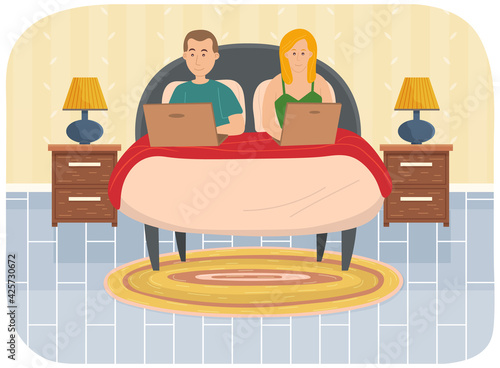Couple man and woman lying on bed, holding laptops. Relaxing at home, leisure, free time after work