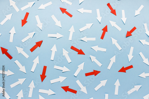 Wallpaper Mural Concept of chaos randomly arranged many white and red paper arrows on blue background. Torontodigital.ca