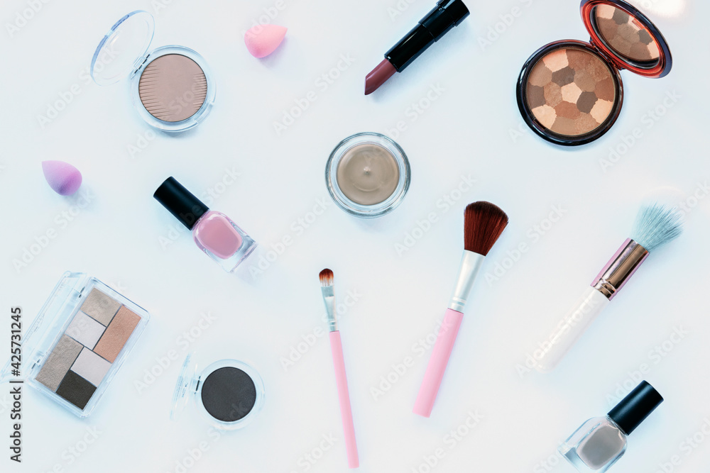 Makeup cosmetic products on white background. Top view, flat lay. Fashion, beauty concept Makeup cosmetic products on white background. Top view, flat lay. Fashion, beauty concept