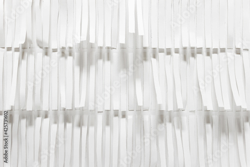 Abstract white hand made 3d pattern with long white paper strips.
