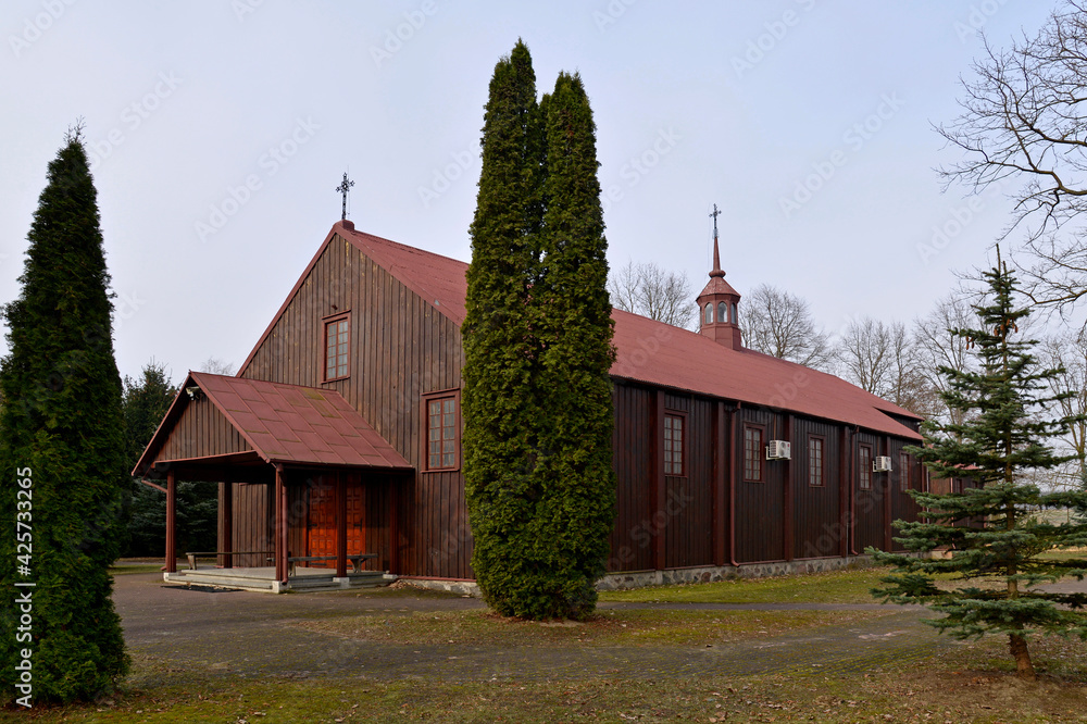 A place of religious worship. The bell tower with the Catholic Church of Our Lady of the Scapular built in 1958 in the village of old nuns in Podlasie, Poland A place of religious worship. The bell tower with the Catholic Church of Our Lady of the Scapular built in 1958 in the village of old nuns in Podlasie, Poland