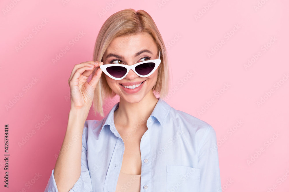 Photo of dreamy stunning young woman look empty space wear sunglass isoalted on pink color background Photo of dreamy stunning young woman look empty space wear sunglass isoalted on pink color background