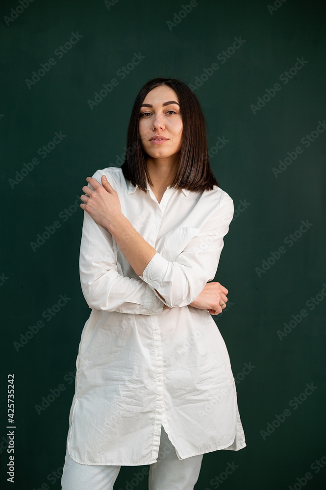 women in white robe on the green background