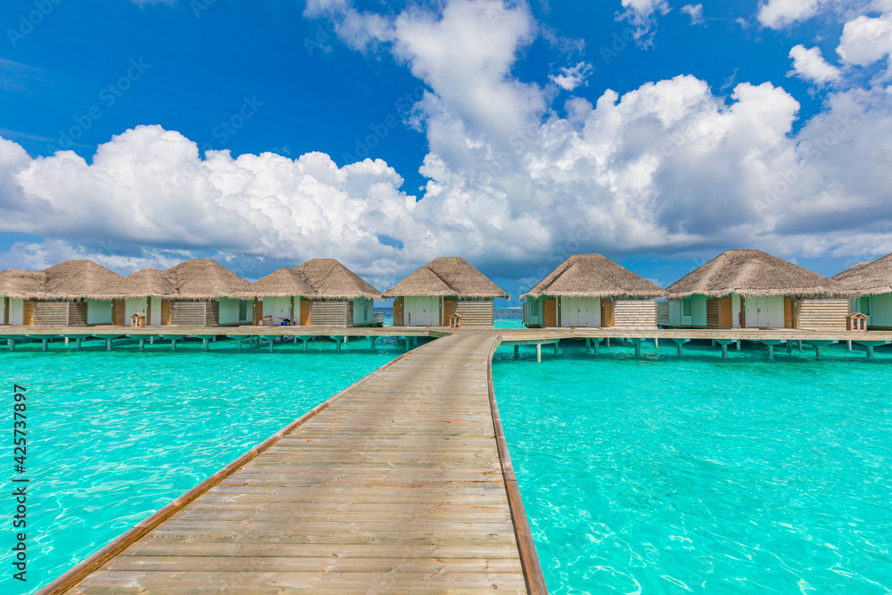 Travel landscape of Maldives beach. Tropical panorama, luxury water villa resort, wooden pier or jetty. Ocean lagoon, seaside. Luxury travel destination background for summer holiday vacation concept.