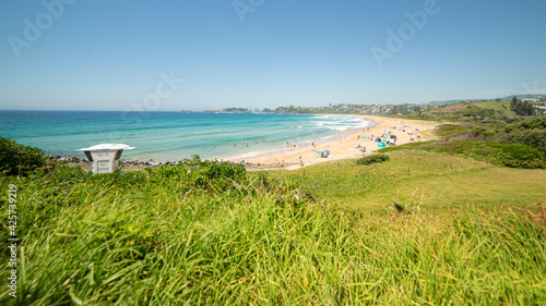 Panoramic View of a beach in Australia with People and Surfers. Bombo Beach  Australia.